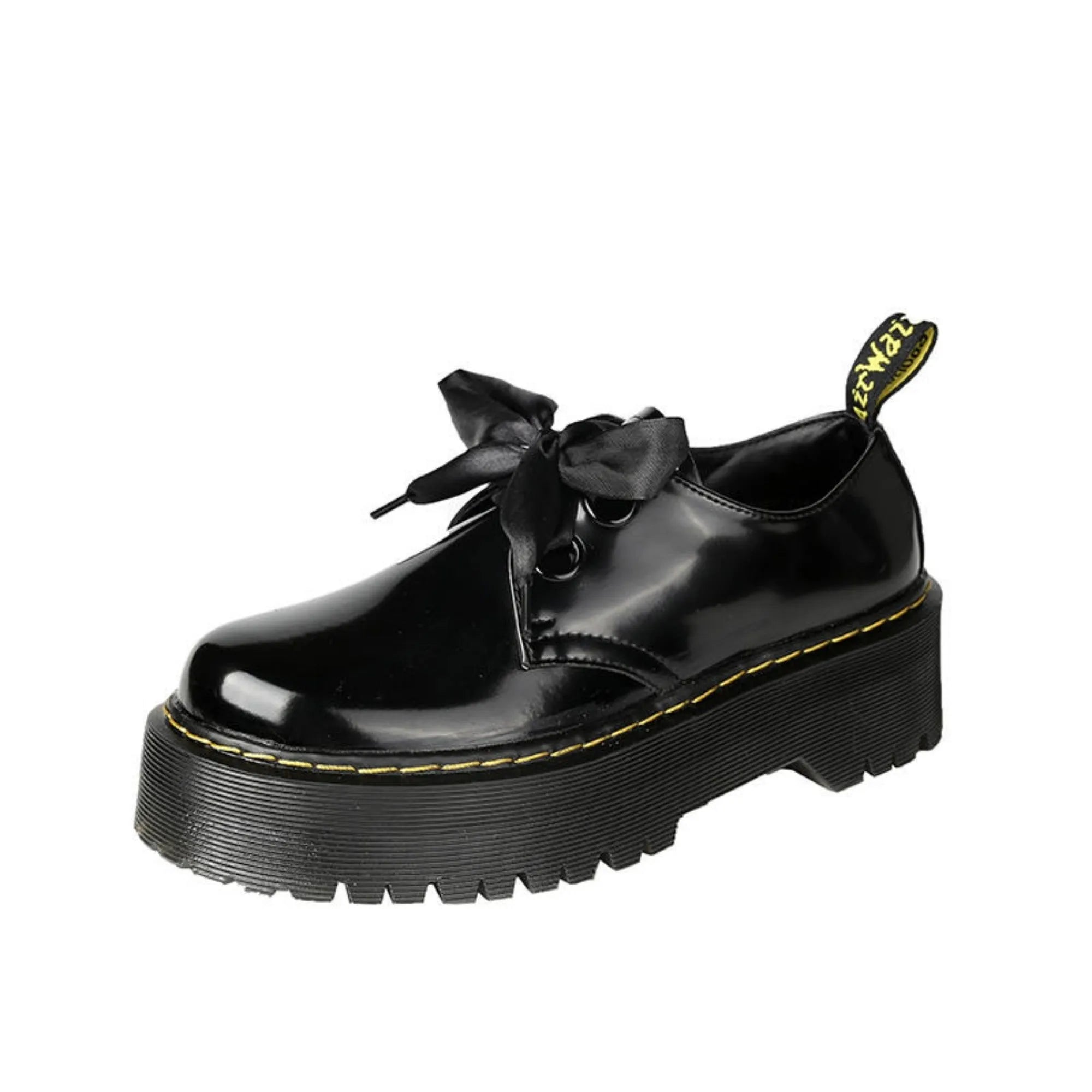 Black thick-soled women's leather shoes with cross-strap ribbons and lace-up closure on a white background.