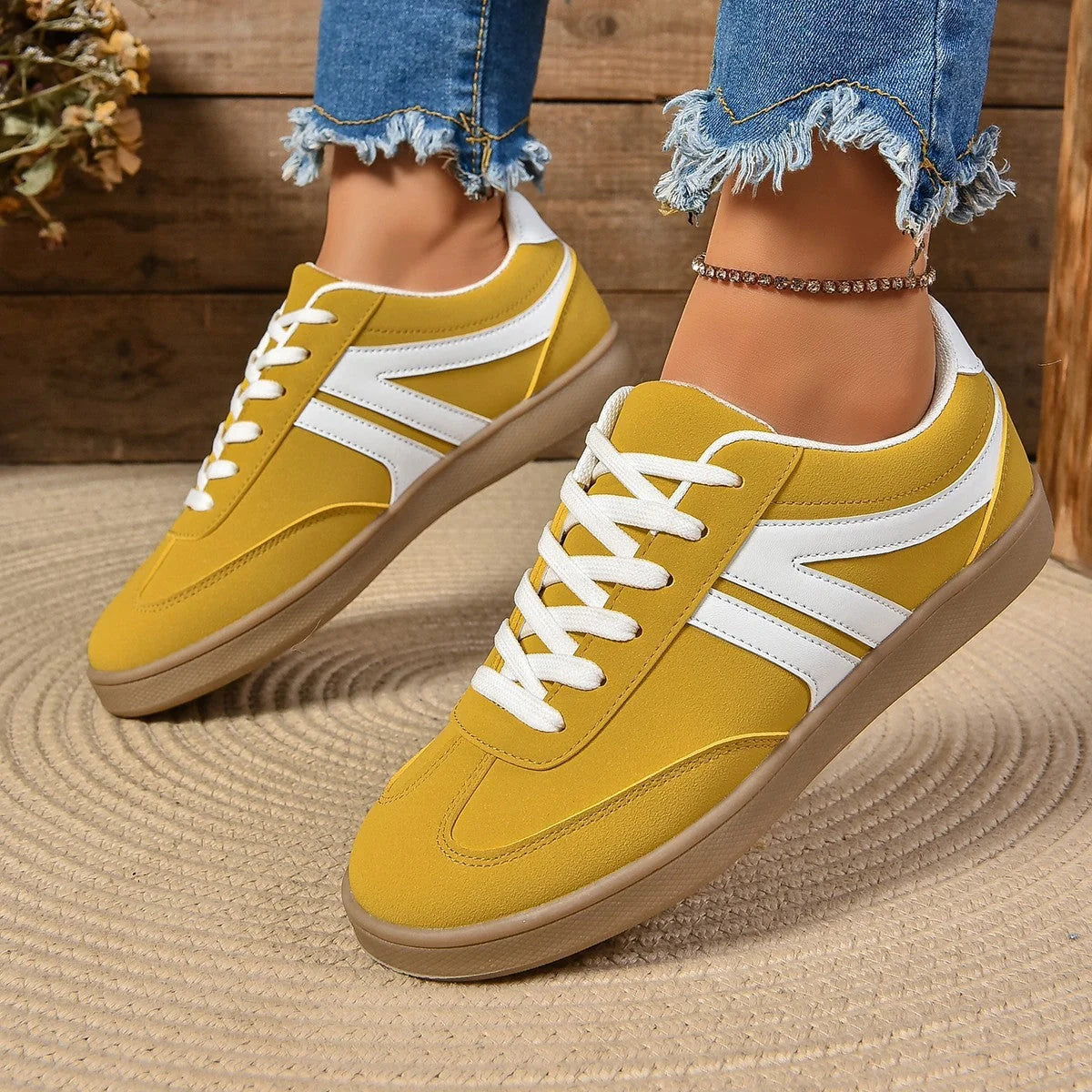 Stylish lace-up flats for women in various colors, perfect for casual wear