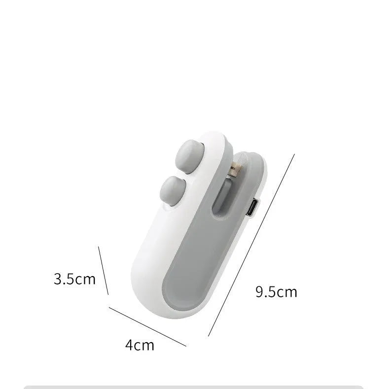 White handheld vacuum sealing machine with magnetic back and cutter blade for chip bags