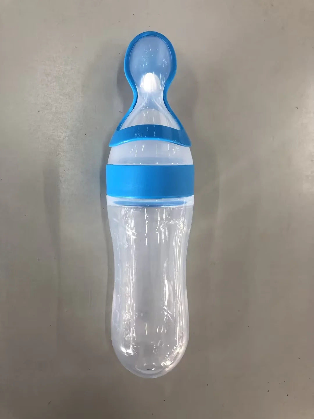 Baby Spoon Bottle Feeder in various colors for easy, safe feeding