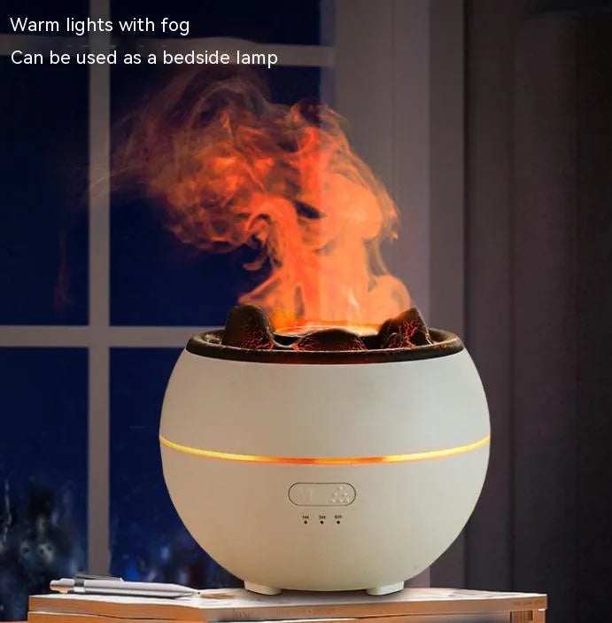White round flame aroma diffuser and humidifier with water tank on a wooden desk