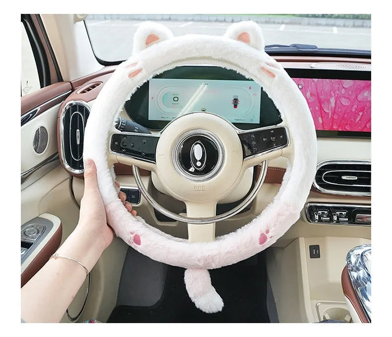 Plush rabbit fur steering wheel cover with embroidered panda design, shown fitted on a car wheel.