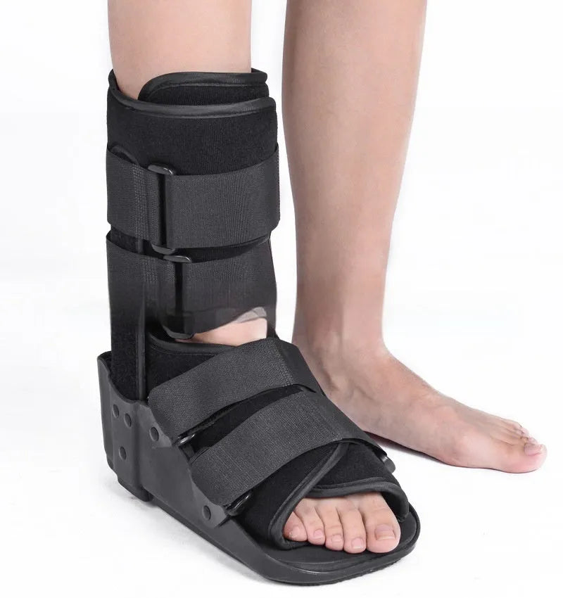 Grey and black adjustable Achilles tendon rehabilitation walking boot with plastic shell and straps.