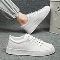 Men's black and white low top sports shoes with mesh and synthetic leather construction