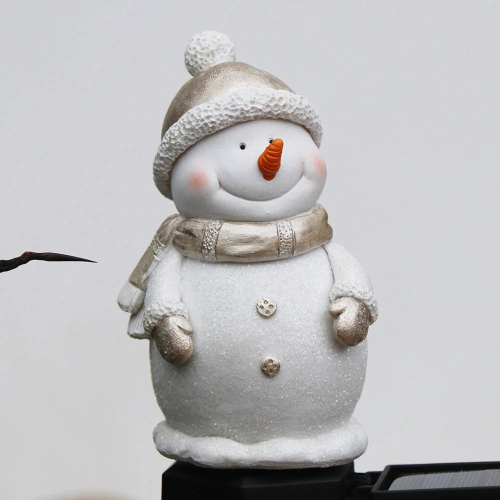 Solar-powered snowman garden light with warm white LED illumination