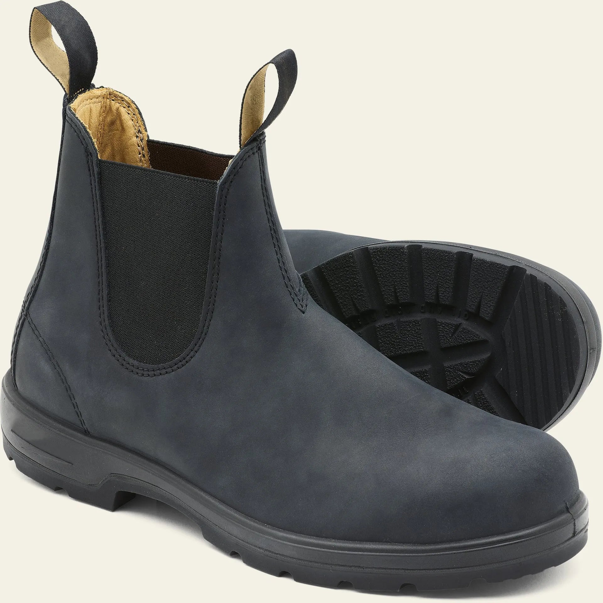 A pair of vintage-style brown unisex Chelsea boots with a round toe and low horseshoe heel.
