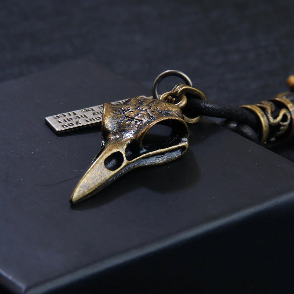 Retro leather rope keychain with lobster buckle and skull pendant in bronze and silver