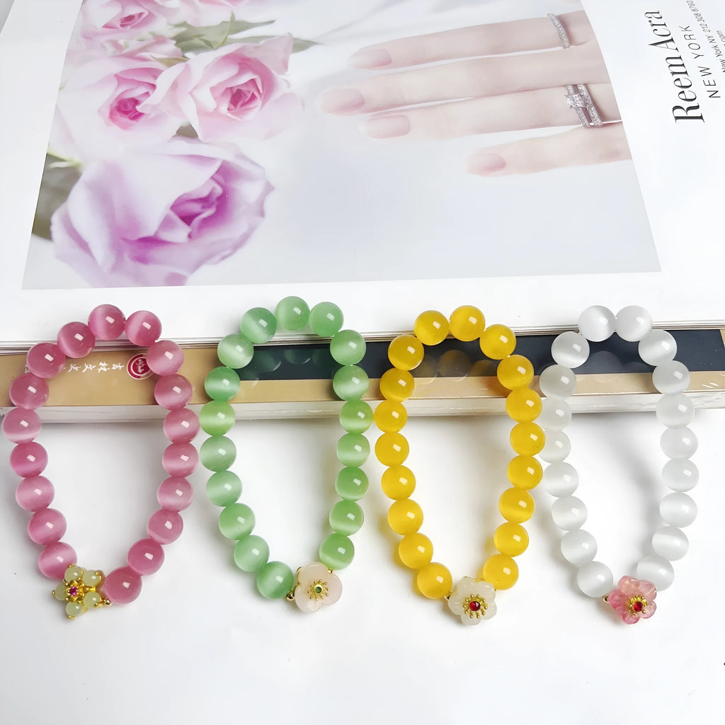 Handmade glass beaded bracelet with floral design in yellow, pink, white, or green colour options.