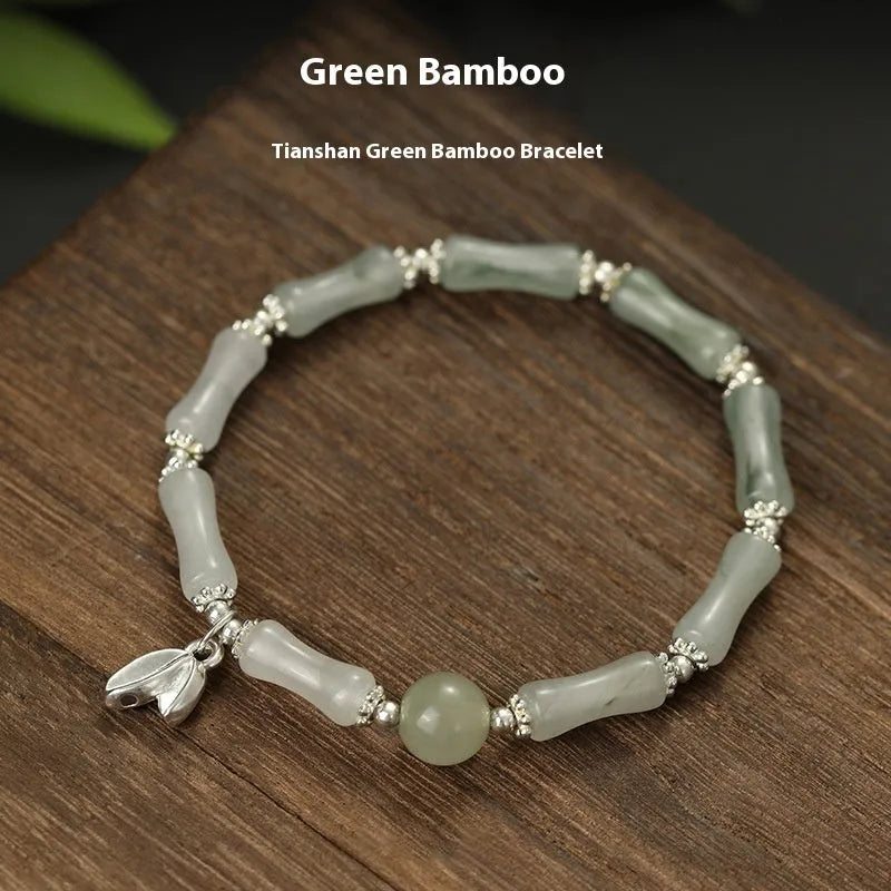 Women's antique-style bracelet made from Tianshan green bamboo and sterling silver with bamboo joint detailing.