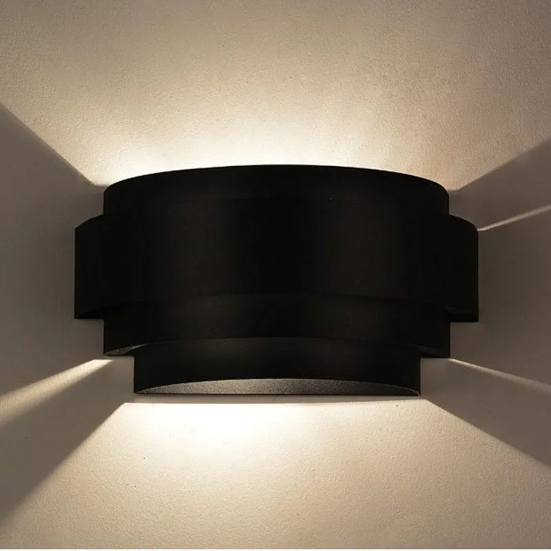 Modern minimalist iron bedside wall lamp in black finish on a wall, 270x135x110mm size