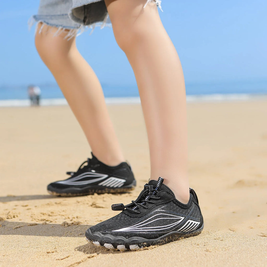 Children's blue swimming shoes with non-slip rubber soles and elastic band closure for beach and pool use