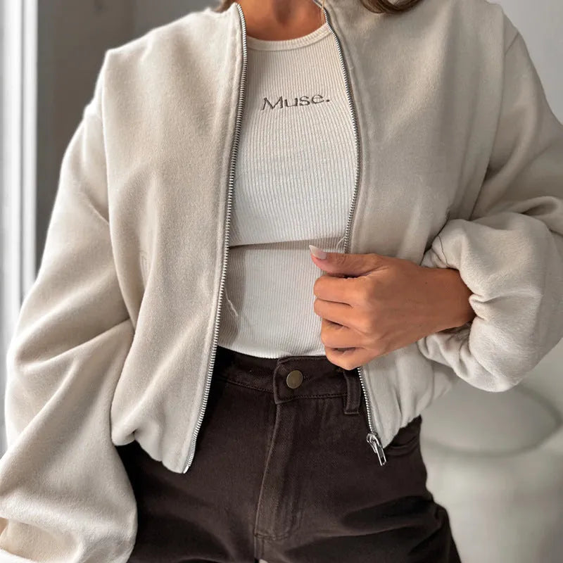 Women's milky white off-shoulder jacket with long lantern sleeves and pockets.