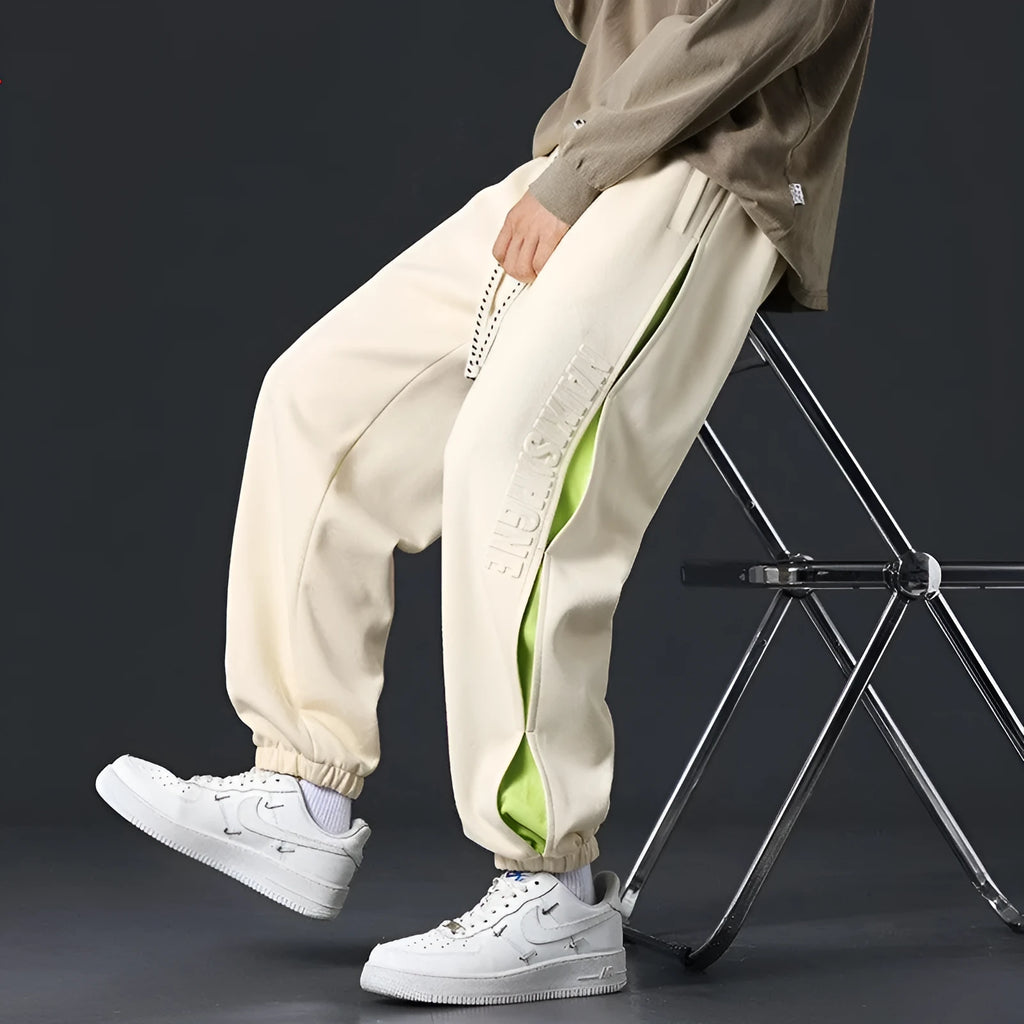 Men's grey green loose fit jogger pants with elasticated ankle bands and waist.