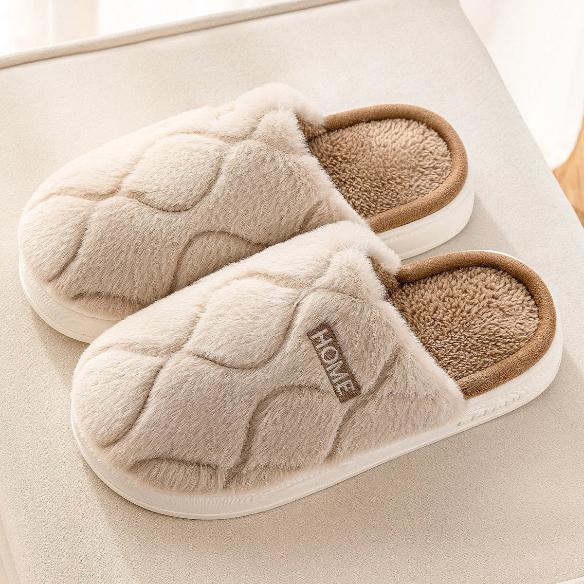 Cozy plush slippers with soft, plush upper material and durable PVC sole for comfortable and secure indoor wear