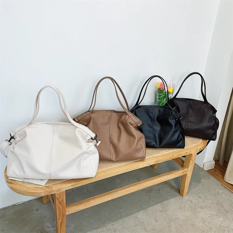 Large soft-surface PU messenger tote bag in a choice of colours, showing internal pockets and adjustable shoulder strap.