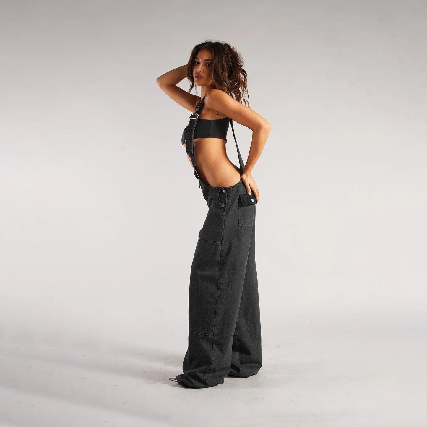 Trendy denim overalls with pockets, featuring a unique Y2K-inspired design, micro-elastic fit, and convenient layout for a stylish and comfortable streetwear look.