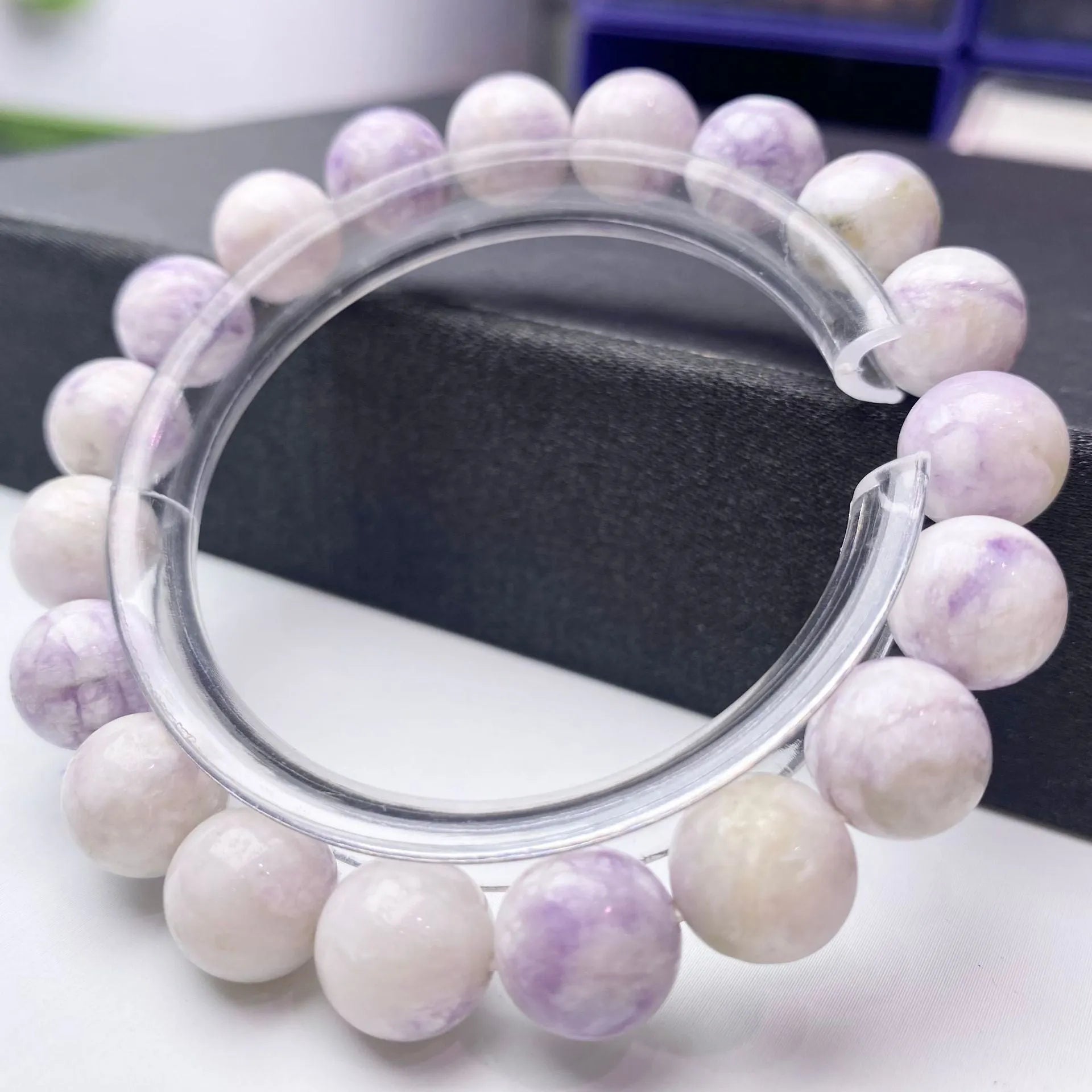 Women's purple turquoise bracelet with natural gemstone beads on a wrist.