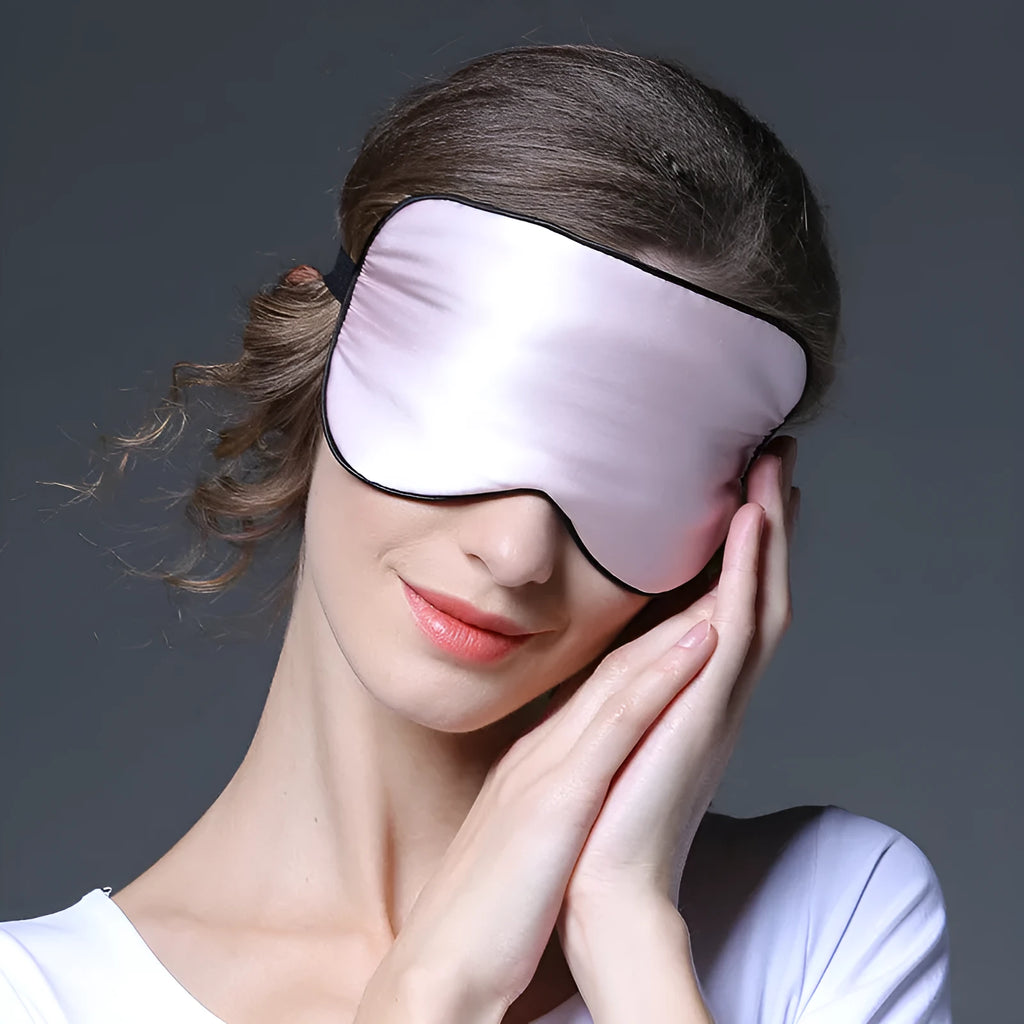 Double-sided mulberry silk eye mask in one of 21 colours, showing embroidered detail and measuring 22x11cm.