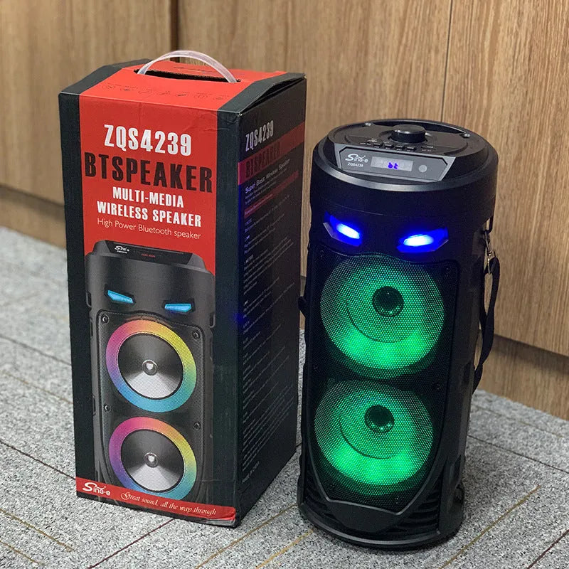 Black portable Bluetooth speaker with dual horn cannon design showing USB charging port and compact dimensions