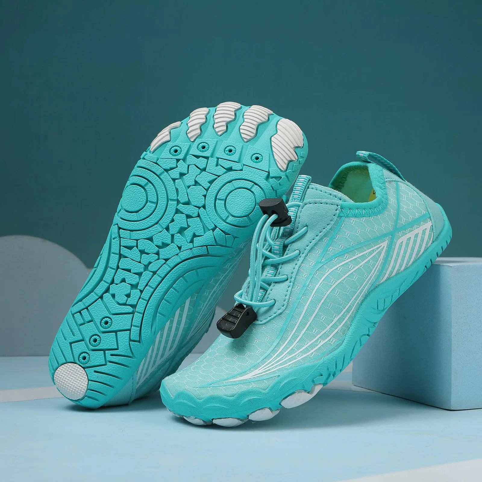 Children's blue swimming shoes with non-slip rubber soles and elastic band closure for beach and pool use
