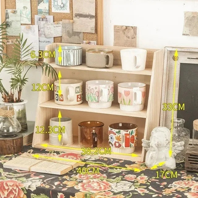 Solid wood multi-layer cup storage box in wood tone, with three layers for organising mugs and cups.