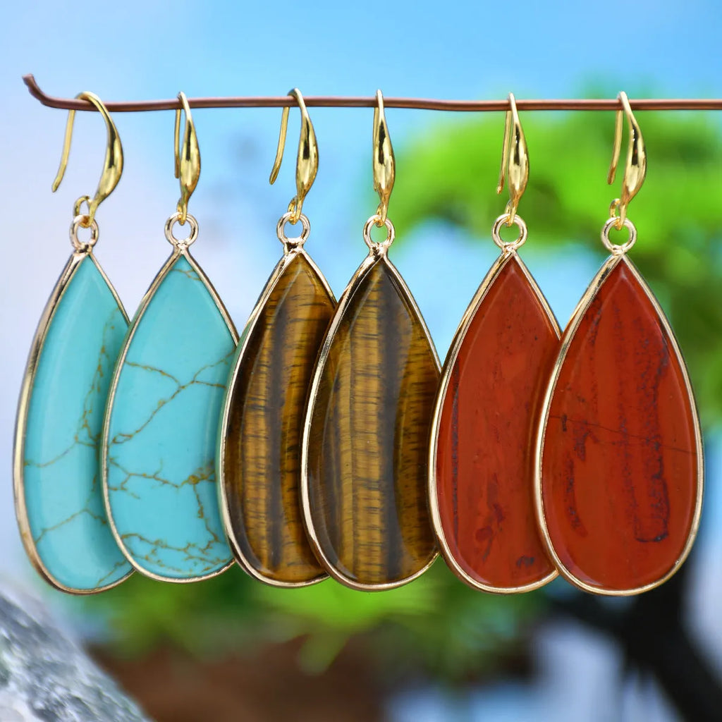 Vintage Tigereye long water drop stone earrings showing textured surface and elongated silhouette