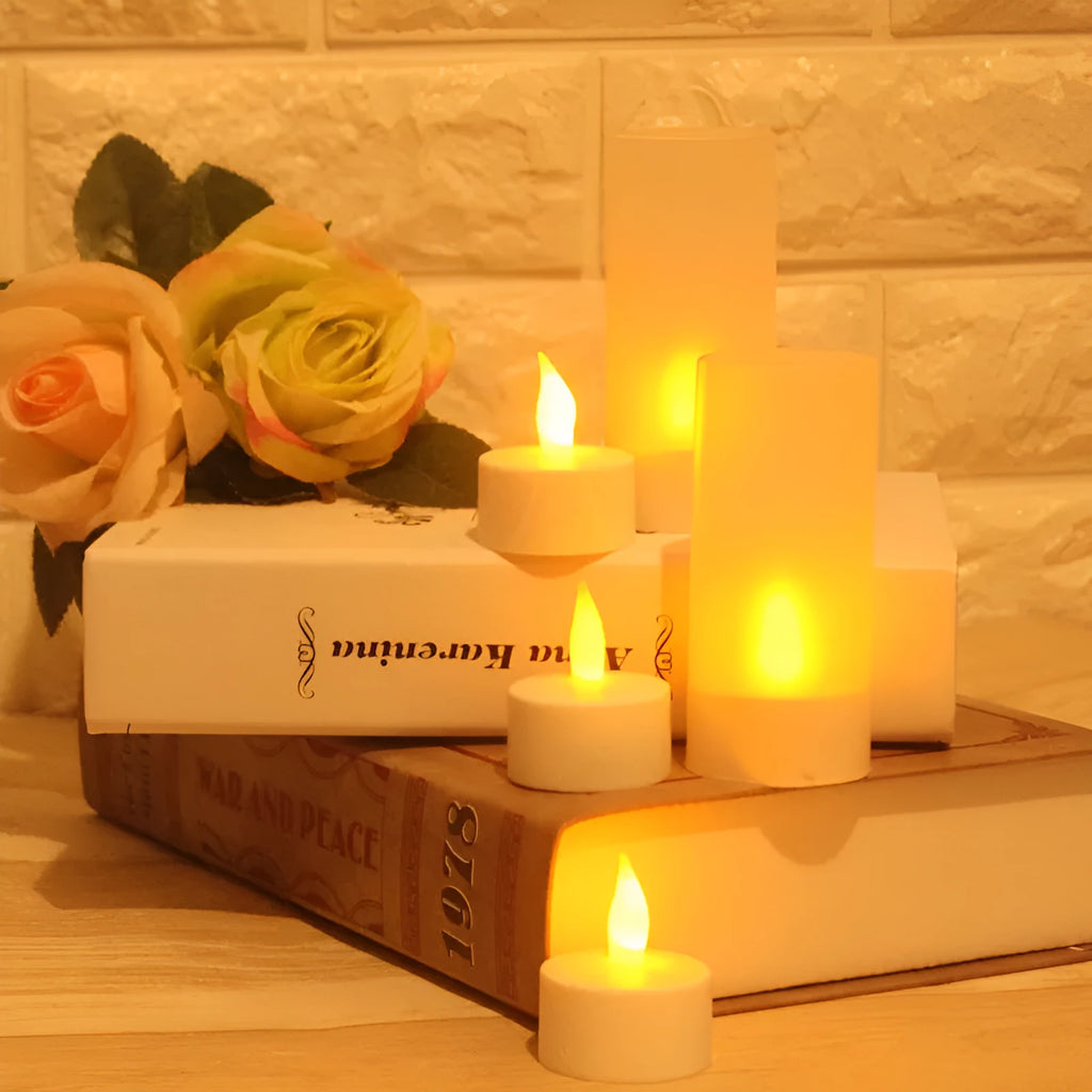 White plastic USB rechargeable LED candle lamp with flickering flame on plastic cup.