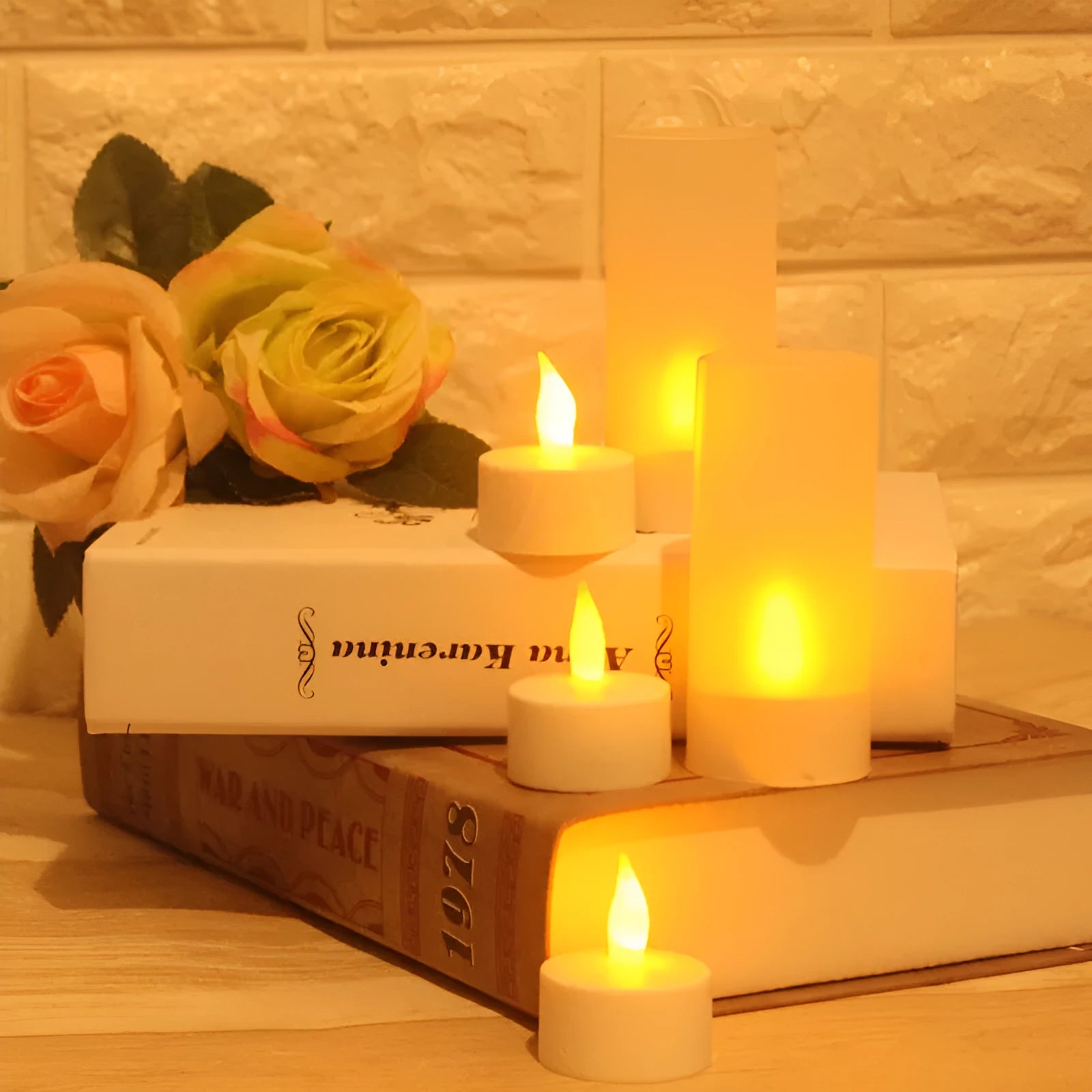 White plastic USB rechargeable LED candle lamp with flickering flame on plastic cup.