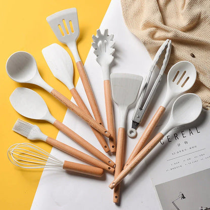 Elegant marbled silicone kitchenware set with wooden handle, perfect for cooking and baking.