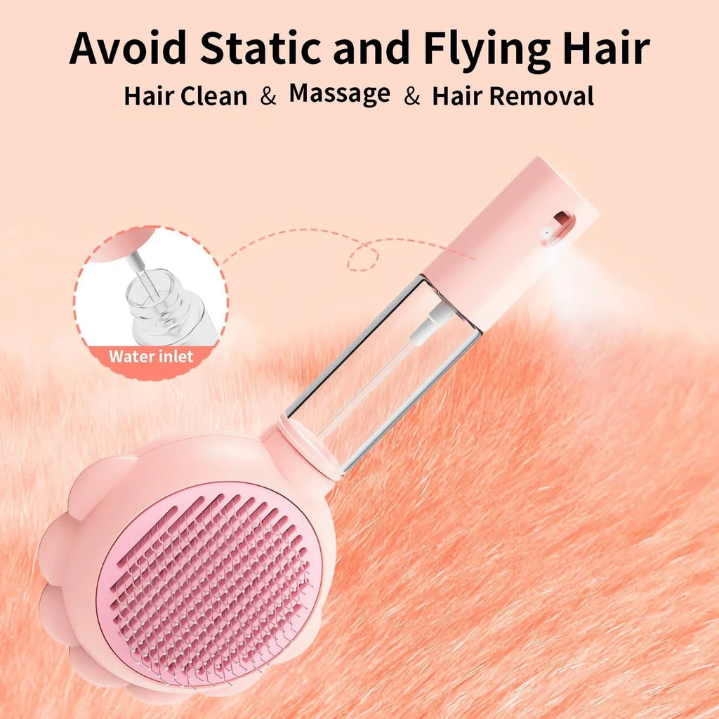 Grey spray cat brush with release button next to a cat, showing curved stainless steel bristles.