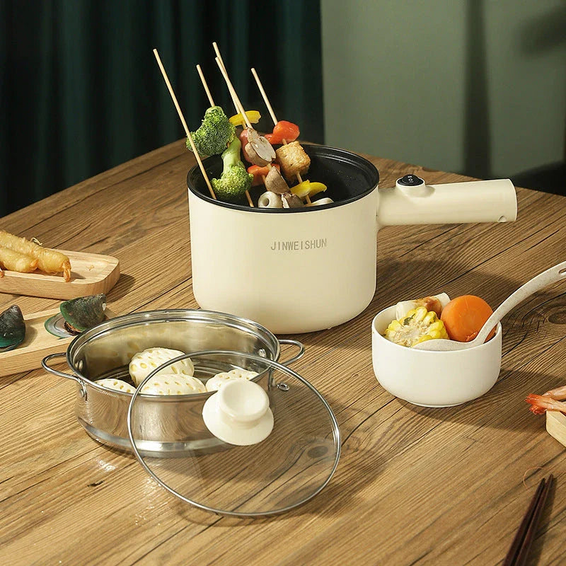 Compact electric hot pot with stainless steel construction, nonstick interior, and versatile cooking functions