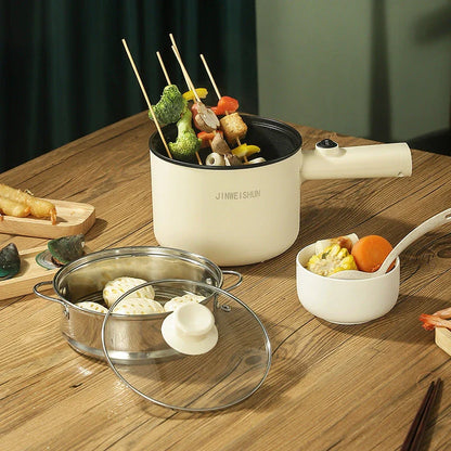 Compact electric hot pot with stainless steel construction, nonstick interior, and versatile cooking functions