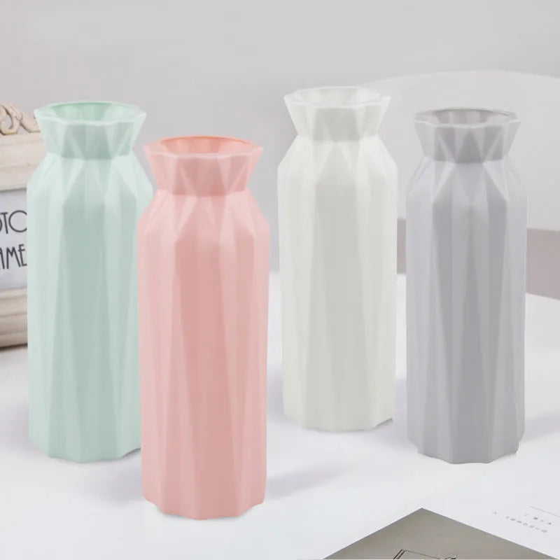 A sturdy green melamine vase with a wide 7.2cm base on a wooden surface.
