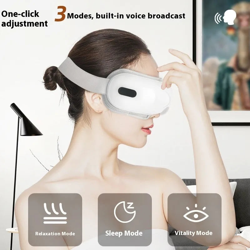 White rechargeable airbag massage eye massager with hot compress function on grey background