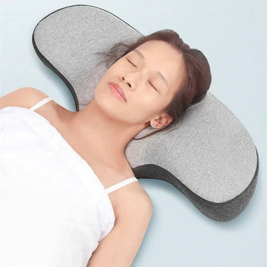 Cozy memory foam pillow with contoured design for optimal neck and spine support, featuring breathable and hypoallergenic materials for a comfortable sleep experience.