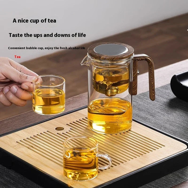 Elegant glass teapot with magnetic separation technology, wooden handle, and drip-free spout for a consistently smooth and flavorful cup of tea