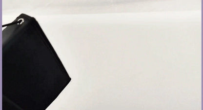 Black 15-piece makeup brush set with wooden handles and folding cloth storage bag