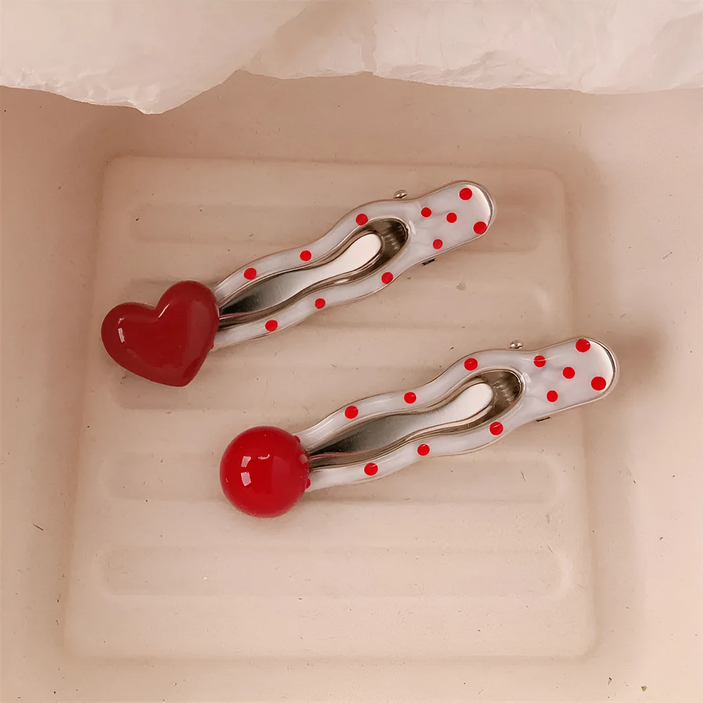 Red stereo love heart-shaped hair clip with French retro dots and willow leaf design.