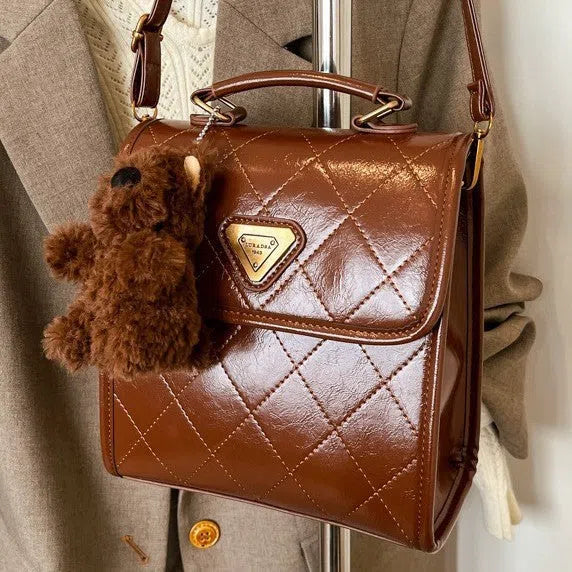 Mini PU backpack in brown with stitching design and a pendant option