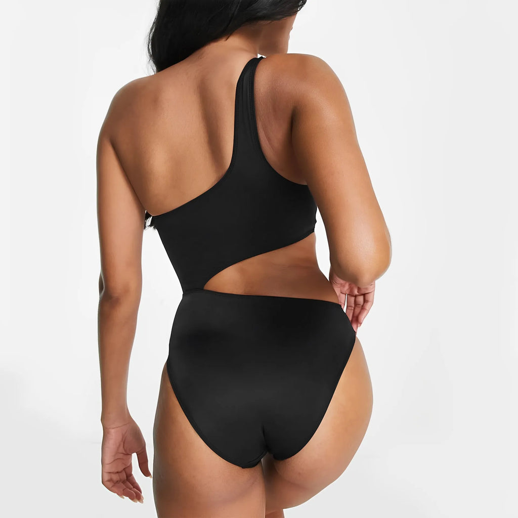 Black women's one-piece swimsuit with white contrast stitching and hollow back design