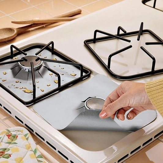 Four reusable, adjustable silicone stove top protective covers in silver and black colours