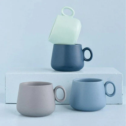 Pastel green ceramic coffee mug with a Kiwiana-inspired design, perfect for daily use in New Zealand homes and cafes.