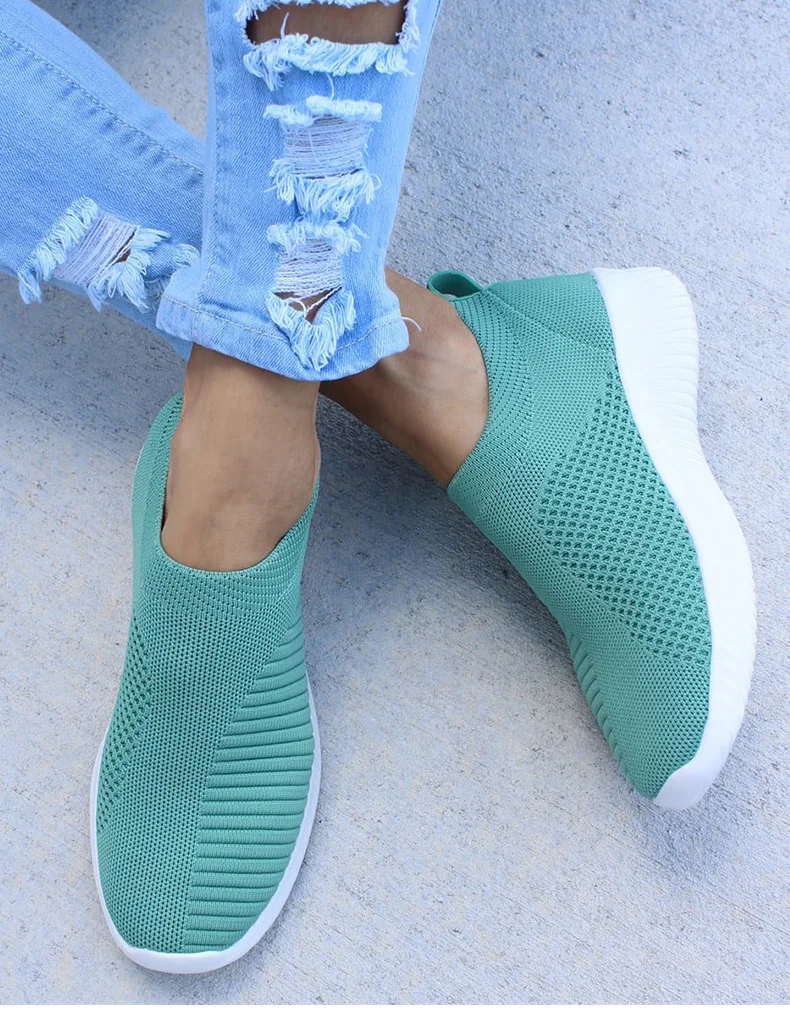 Ultra-comfortable casual slip-on summer sneakers in various colours, featuring a stretch fabric upper, rubber outsole, and cotton lining for a relaxed, breathable fit.