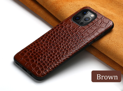 Durable leather iPhone case with shock-absorbing frame, elevated camera cover, and oleophobic coating for premium protection