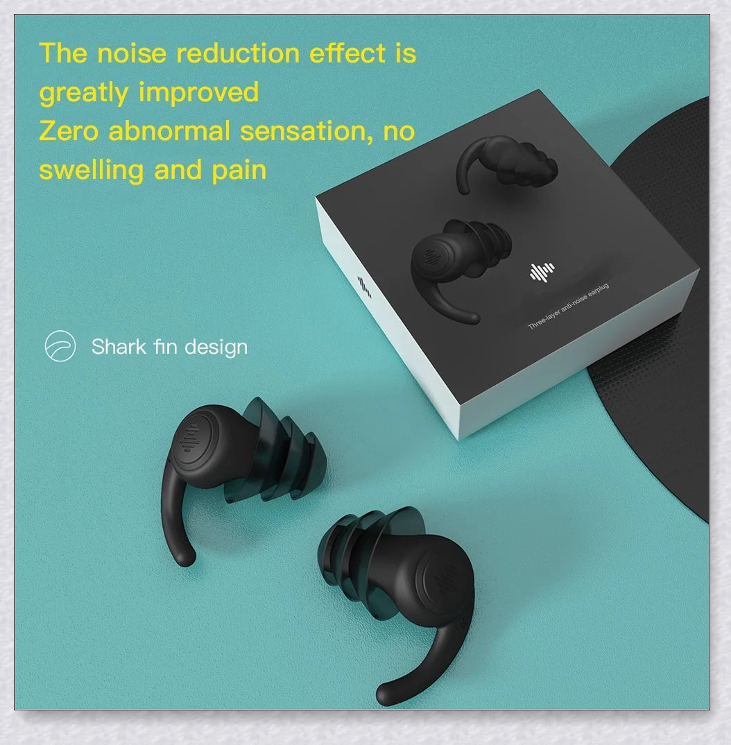 Pair of silicone ear plugs in black and white colors, designed for comfortable and effective noise reduction during sleep