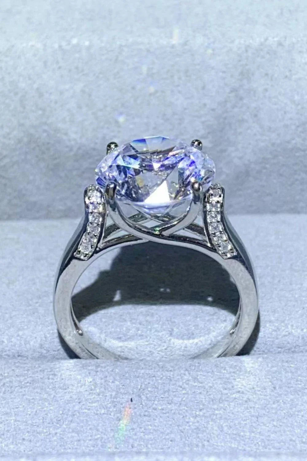 Elegant 5-Carat Moissanite Ring in Platinum Plating with a minimalist design and sparkling zircon accent stones