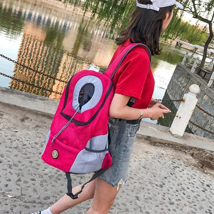 A compact dog carrier backpack with a head hole for your small dog to enjoy the ride comfortably and securely.