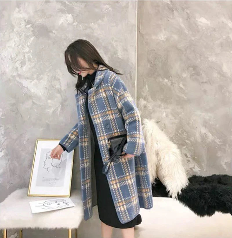 A cosy, plaid jumper coat made from a luxurious blend of mink hair and acrylic for maximum warmth and style.