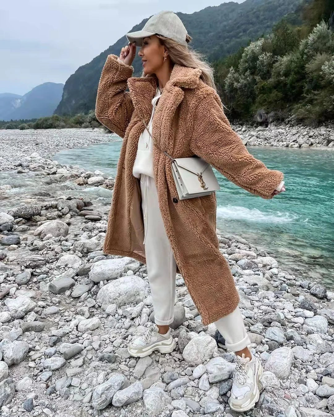 Stylish women's long fur coat with an irregular single-breasted design, available in a range of classic Kiwi-inspired colours