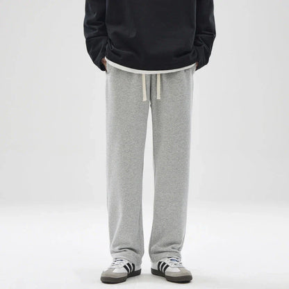 Straight gray sweatpants with a chic draping effect, perfect for Kiwi casual fashion